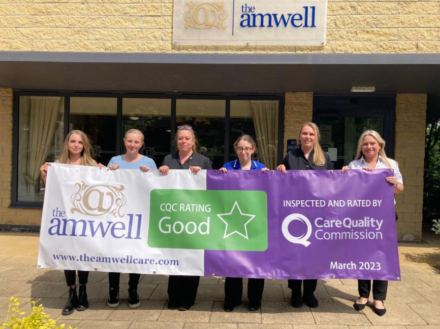 The Amwell's team with cqc 'good' banner