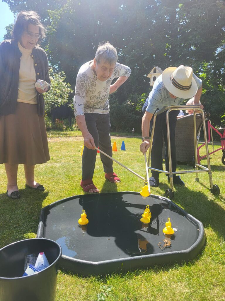 Our residents playing hook a duck