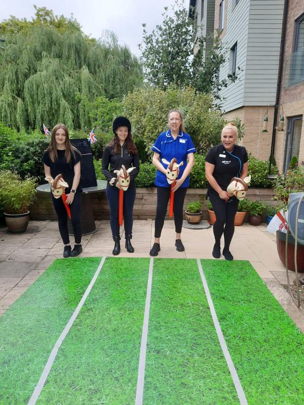 Care Home Staff Racing Stick Horses