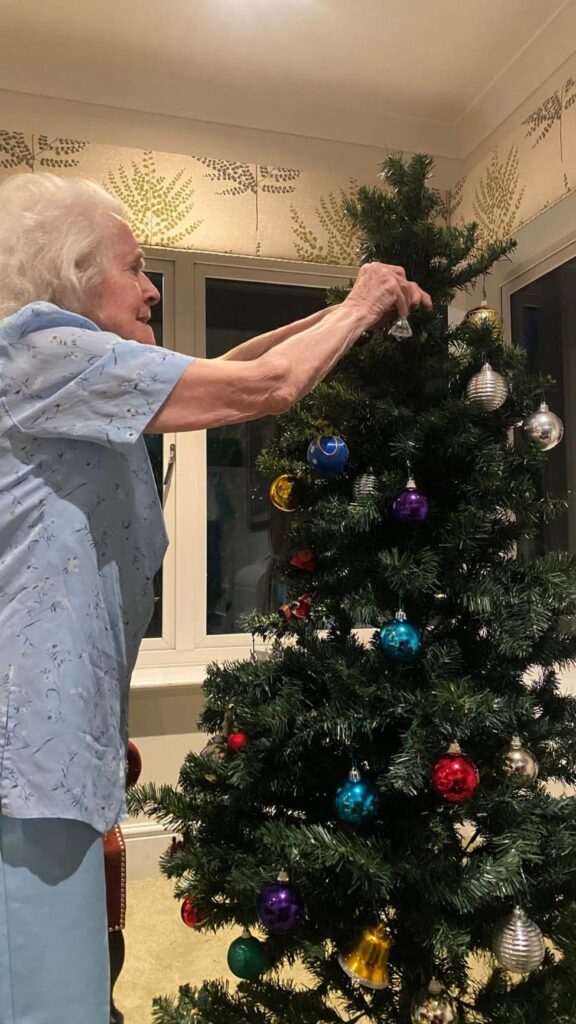 resident decorating our christmas tree