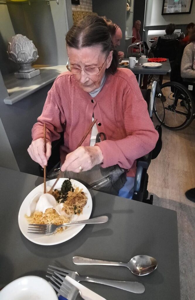 resident enjoying chinese food for the new year