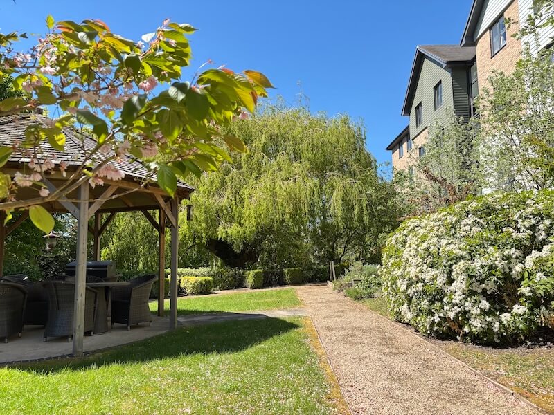 a photo of the garden at The Amwell Care Home with a sheltered seating area