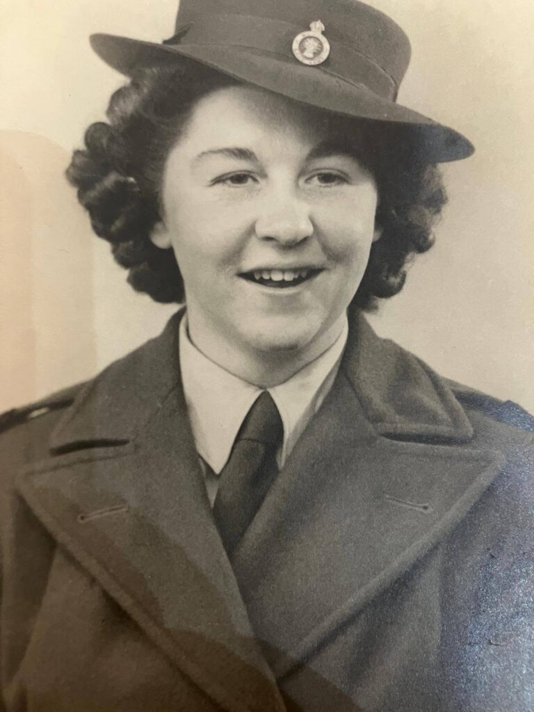 black and white photo of a lady in uniform